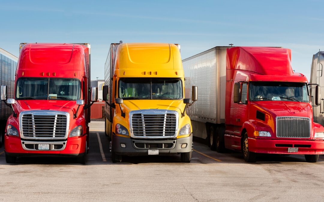 Image of three transporting trucks in a row